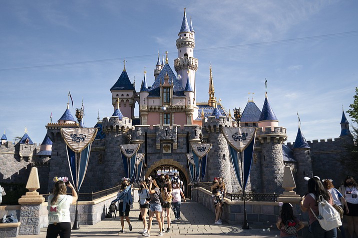 Visitors pass through Disneyland in Anaheim, Calif., on April 30, 2021. A lawsuit claims Disneyland employees snickered at Joanne Aguilar, 66, a disabled woman struggling to get off a Jungle Cruise boat, before she fell and broke a leg on Aug. 22, 2021, leading to her death from an infection five months later. (Jae C. Hong/AP, File)
