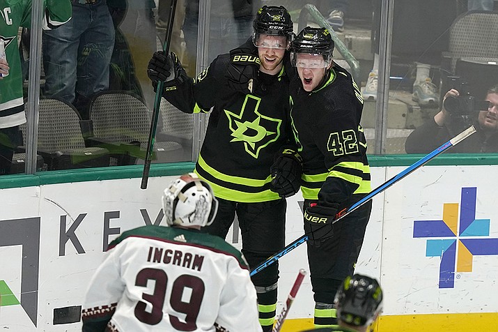 Dallas Stars center Radek Faksa (12) celebrates after his goal with teammate left wing Fredrik Olofsson (42) in front of Arizona Coyotes goaltender Connor Ingram (39) during the first period of an NHL hockey game in Dallas, Saturday, Jan. 21, 2023. (LM Otero/AP)