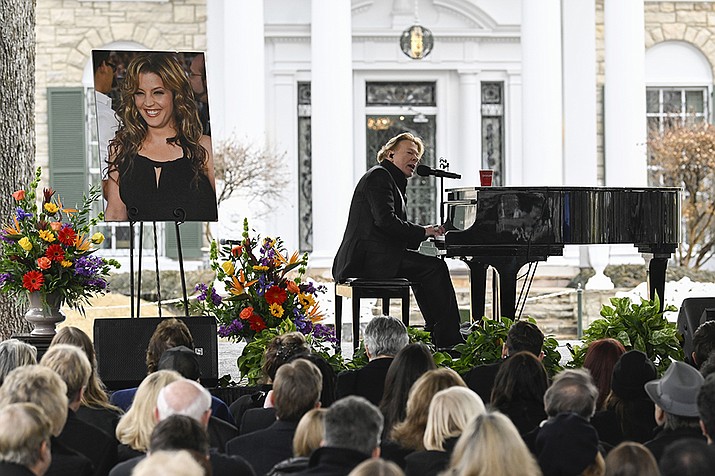 Axl Rose performs during a memorial service for Lisa Marie Presley Sunday, Jan. 22, 2023, in Memphis, Tenn. She died Jan. 12 after being hospitalized for a medical emergency and was buried on the property next to her son Benjamin Keough, and near her father Elvis Presley and his two parents. (John Amis/AP)