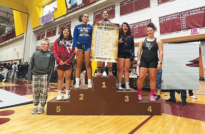 Mustang wrestlers performed Jan. 14 at the Doc Wright Invitational. M. Kescoli was able to bring some bling back to add to her collection. (Photo/MVHS)