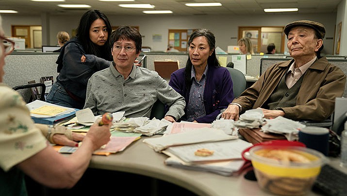 From left, Michelle Yeoh, James Hong, Ke Huy Quan, and Stephanie Hau are shown in a scene from Hsu in Everything Everywhere All at Once. The movie has been nominated for 11 Academy Awards. (imbd photo)