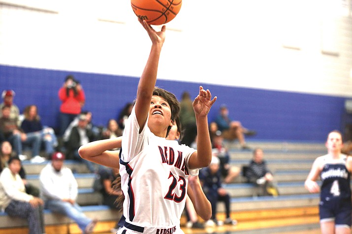 Delmarina Johnson makes up a layup during the Yvonne Johnson Memorial Tournament in Camp Verde last month. The teams finish out the season this week with Basis Jan. 23, and then face Williams on the road Jan. 27. (Marilyn R. Sheldon/NHO)