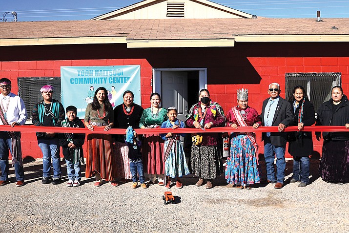 Local and state leaders join former Yee Ha'ólníi Doo Executive Director Ethel Branch (center) in the ribbon cutting ceremony at the grand opening of the Tooh Haltsooi Community Center. (Photo/Tooh Haltsooi Community Center)