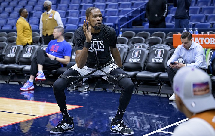 Brooklyn Nets forward Kevin Durant warms up before an NBA basketball game against the New Orleans Pelicans in New Orleans, Friday, Jan. 6, 2023. (Matthew Hinton/AP)