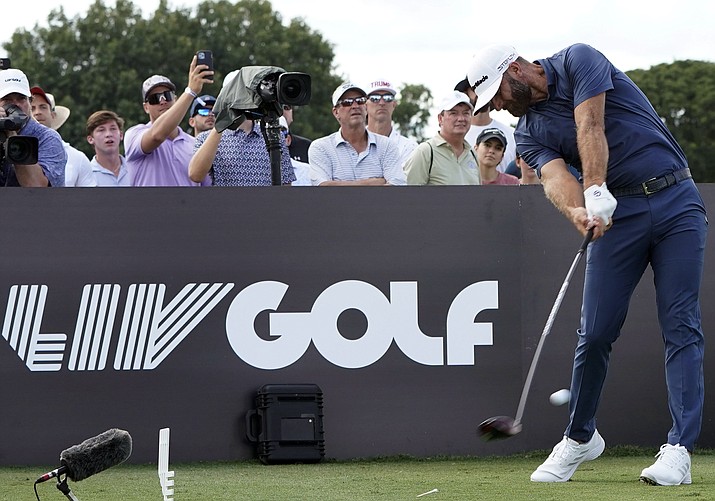 Dustin Johnson hits from the third tee during the second round of the LIV Golf Team Championship at Trump National Doral Golf Club, Oct. 29, 2022, in Doral, Fla. (Lynne Sladky/AP, File)