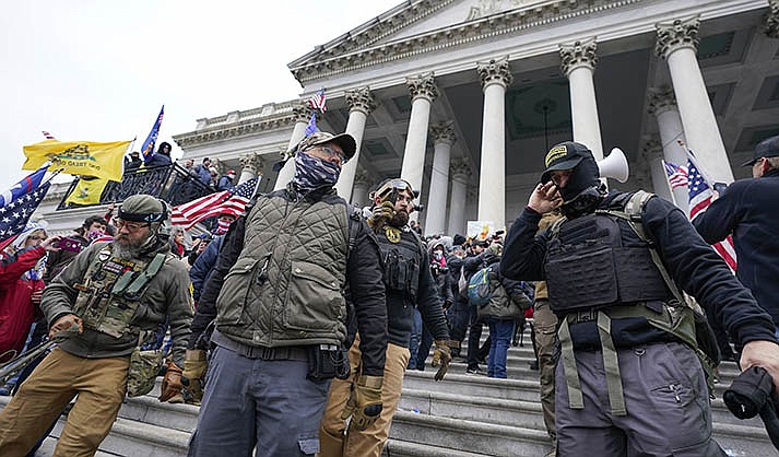 Members of the Oath Keepers stand on the East Front of the U.S. Capitol on Jan. 6, 2021, in Washington. (AP Photo/Manuel Balce Ceneta, File)