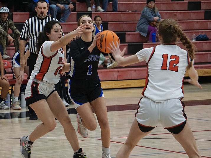 Prescott’s Zoe Libis (1) drives to the basket against Bradshaw Mountain’s Kendra Logan (14) and Kalli Smith (12) during a girls basketball game on Thursday, Jan. 26, 2023, in Prescott Valley. (Aaron Valdez/Courier)