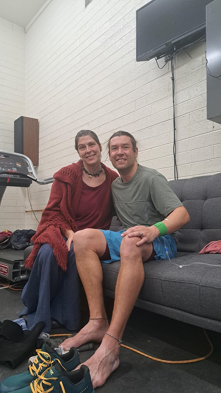 Prescott Fire Department Engineer Jason Heartisan is pictured with his wife, Hilary, after running 24 hours on a treadmill blindfolded. (Debra Winters/Courier)