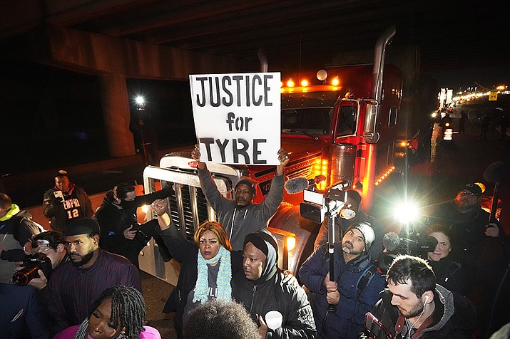 Protesters march down the street Friday, Jan. 27, 2023, in Memphis, Tenn., as authorities release police video depicting five Memphis officers beating Tyre Nichols, whose death resulted in murder charges and provoked outrage at the country's latest instance of police brutality. (Gerald Herbert/AP)
