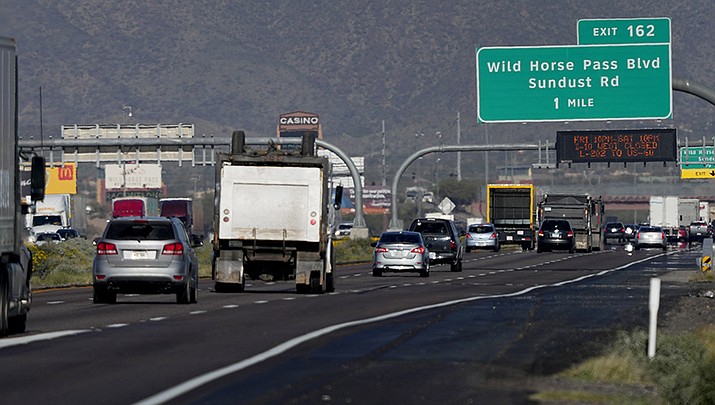 Traffic moves along the notoriously congested stretch of I-10 through tribal land called the Wild Horse Pass Corridor, Wednesday, Jan. 25, 2023 in Chandler, Ariz. With the Gila River Indian Community's backing, Arizona allocated or raised about $600 million of a nearly $1 billion plan that would widen the most bottleneck-inducing, 26-mile section of I-10 on the route between Phoenix and Tucson. But its request for federal money to finish the job fell short — a victim of the highly competitive battle for transportation grants under the new infrastructure law. (Matt York/AP)