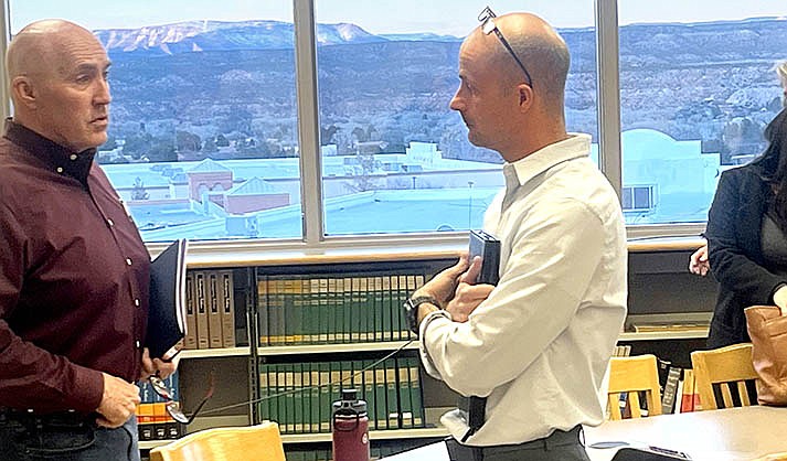 Mingus High School Governing Board Member Austin Babcock, right, talks with Mike Westcott,  Mingus superintendent, after a special board meeting Wednesday, Jan. 25, 2023. (VVN/Vyto Starinskas)