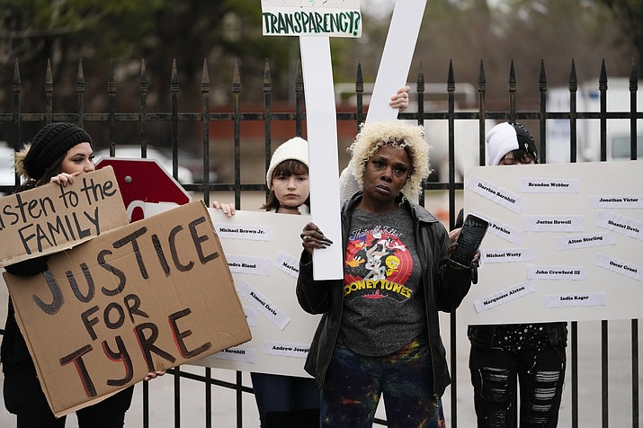 A group of demonstrators protest outside a police precinct in response to the death of Tyre Nichols, who died after being beaten by Memphis police officers, in Memphis, Tenn., Sunday, Jan. 29, 2023. (Gerald Herbert/AP)