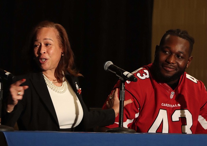 Collette V. Smith, who was the first Black woman to coach in the NFL, and Arizona Cardinals player Jesse Luketa speak as part of a panel at the It’s a Penalty event in Phoenix Jan. 25, 2023. (Paula Soria/Cronkite News)