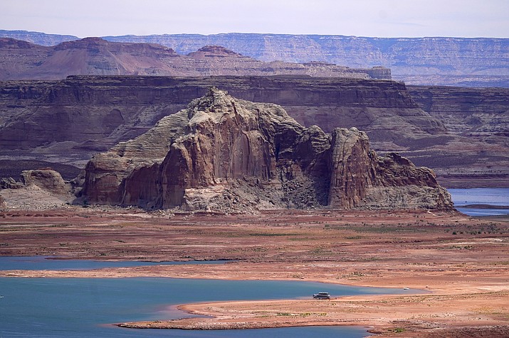 Low water levels at Wahweap Bay at Lake Powell along the Upper Colorado River Basin are shown, June 9, 2021, at the Utah and Arizona border at Wahweap, Ariz. The Biden administration announced Thursday, Feb. 2, 2023, that 15 Native American tribes will get a total of $580 million in federal money this year for water rights settlements. (Ross D. Franklin/AP, File)