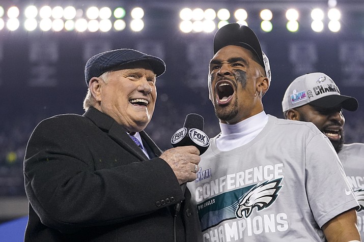 Philadelphia Eagles quarterback Jalen Hurts reacts while speaking to Terry Bradshaw, left, after the NFC Championship NFL football game between the Philadelphia Eagles and the San Francisco 49ers on Sunday, Jan. 29, 2023, in Philadelphia. The Eagles won 31-7. (Matt Slocum/AP)