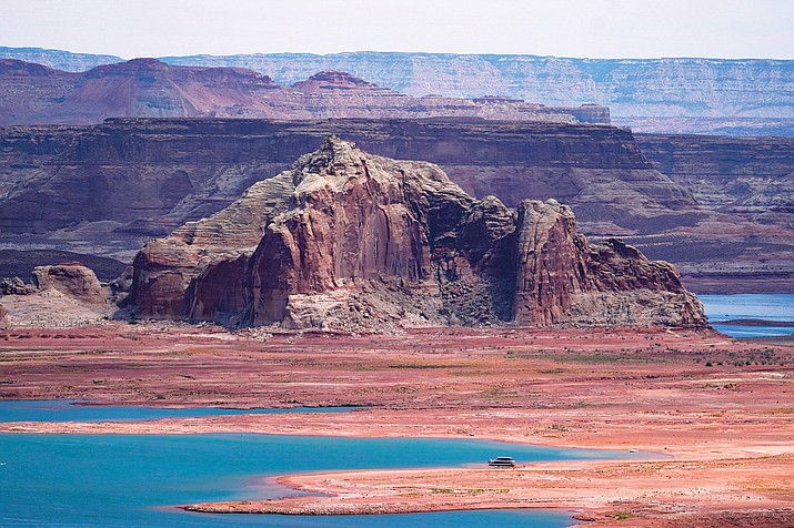 Low water levels at Wahweap Bay at Lake Powell along the Upper Colorado River Basin are shown, June 9, 2021, at the Utah and Arizona border at Wahweap, Ariz. The Biden administration announced Thursday, Feb. 2, 2023, that 15 Native American tribes will get a total of $580 million in federal money this year for water rights settlements. (Photo/Ross D. Franklin, AP)