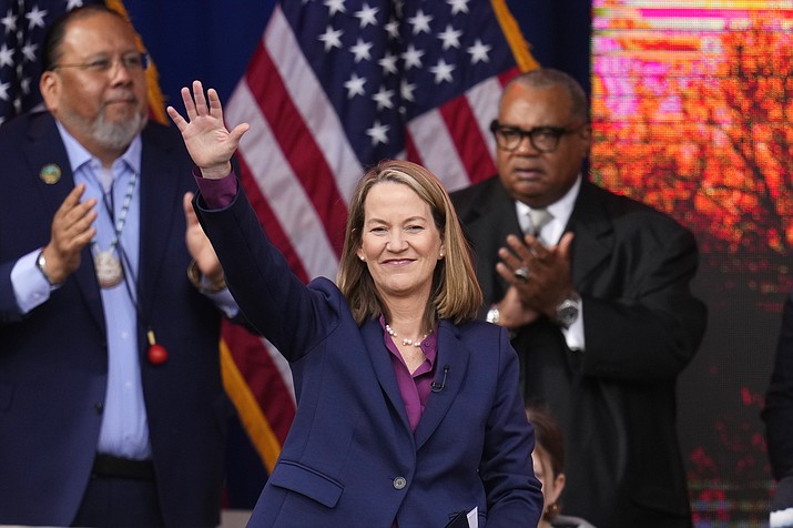 The new Arizona Attorney General Kris Mayes, a Democrat, waves to the crowd after taking the ceremonial oath of office during a public ceremonial inauguration at the state Capitol in Phoenix, Thursday, Jan. 5, 2023. (Ross D. Franklin/AP)