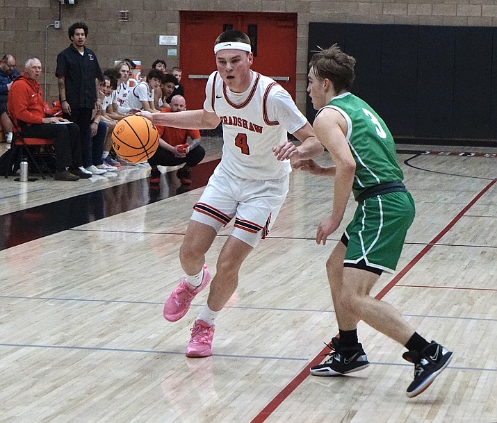 Bradshaw Mountain guard Mason Hunt (4) tries to dribble around St. Mary’s guard Kenny White (3) during a game on Wednesday, Jan. 8, 2023, at the Bradshaw Mountain gym in Prescott Valley. (Aaron Valdez/Courier)