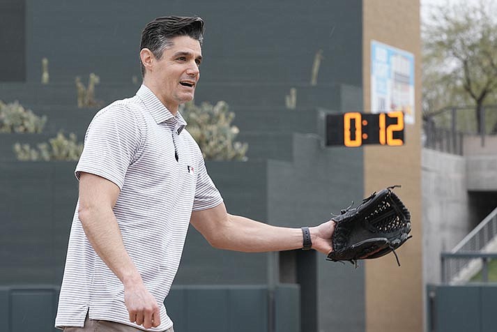 Major League Baseball Vice President of On-Field Strategy Joe Martinez demonstrates some of the new rule changes for the 2023 season, Tuesday, Feb. 14, 2023, in Scottsdale. (AP Photo/Morry Gash)