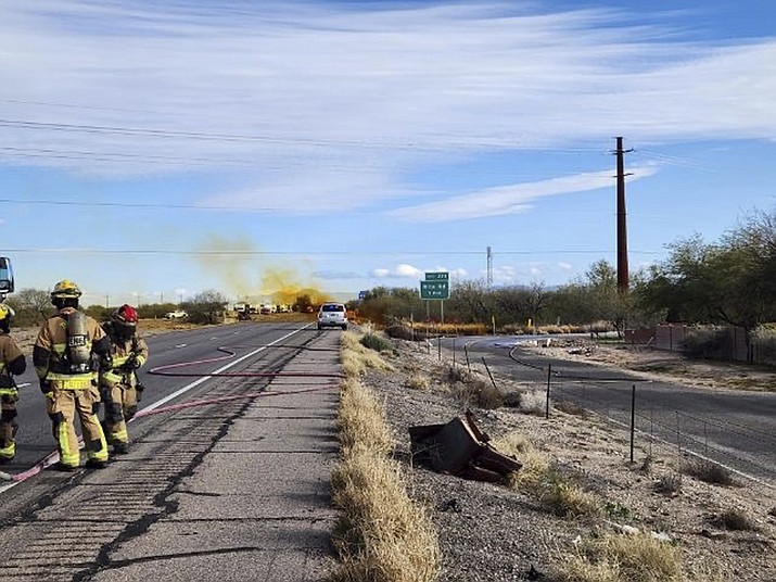 This Tuesday, Feb. 14, 2023, image provided by the Arizona Department of Public Safety shows an accident involving a commercial tanker truck caused a hazardous material to leak onto Interstate 10 outside Tucson, Ariz., prompting state troopers to shut down traffic on the freeway. Agency spokesman Raul Garcia said liquid nitric acid was leaking after the tanker rolled over in the Tuesday afternoon accident on the interstate between Rita and Kolb Roads. (Arizona Department of Public Safety via AP)