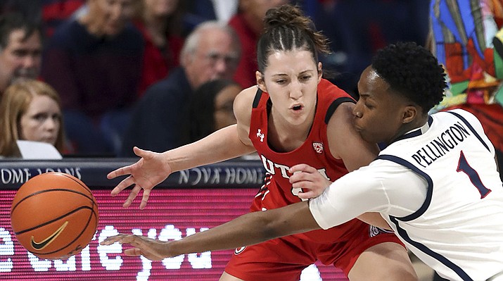 Arizona guard Shaina Pellington (1) manages to temporarily knock the ball away from Utah guard Isabel Palmer (1) during an NCAA college basketball game Friday, Feb. 17, 2023, in Tucson, Ariz. (Kelly Presnell/Arizona Daily Star via AP)
