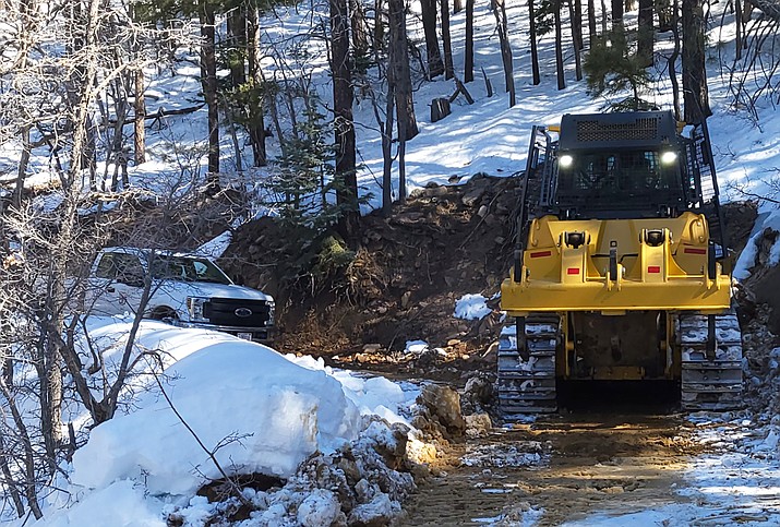 Using a bulldozer to clear the roadway, YSCO and PNF freed a couple who had been snowed in for five weeks. (Photo/YCSO)