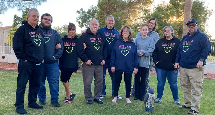 Paul Whitaker, rear center, and family members wearing sweaters with the GrandPaul Recycling logo. (Paul Whitaker/Courtesy)