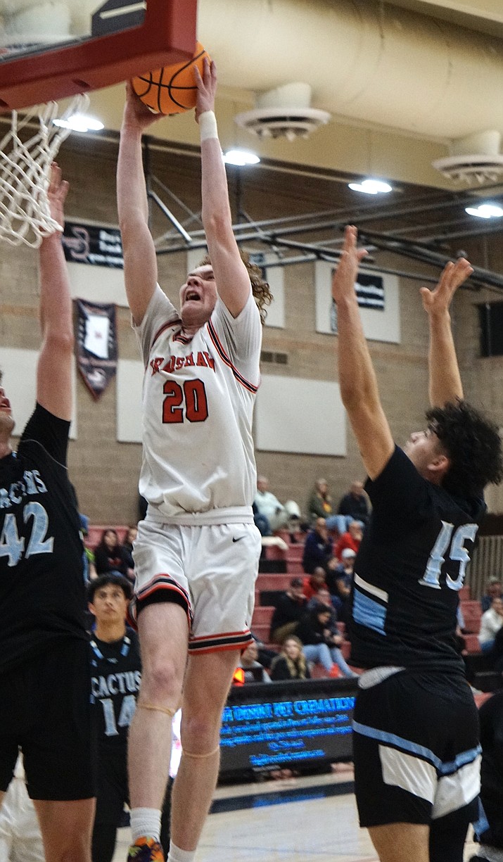 Bradshaw Mountain forward Ben Wilder (20) goes up for a dunk during a 4A state quarterfinal game against Cactus on Friday, Feb. 24, 2023, in Prescott Valley. (Aaron Valdez/Courier)
