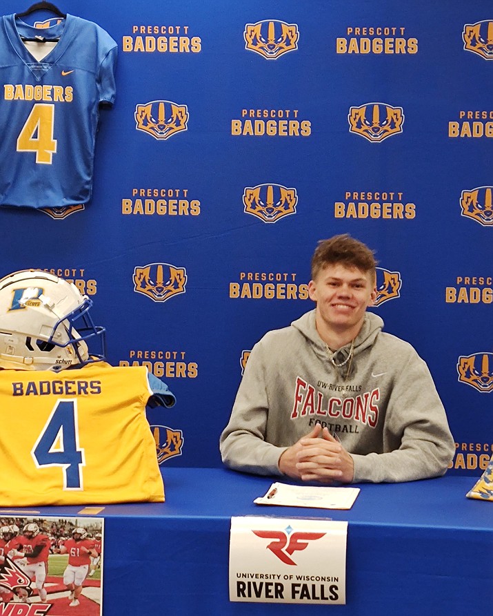 Prescott wide receiver Jake Hilton signed his letter of intent to continue his athletic career at the University of Wisconsin-River Falls on Monday, Feb. 27, 2023, at the Prescott High School Library. (Thomas Staples/Courier)