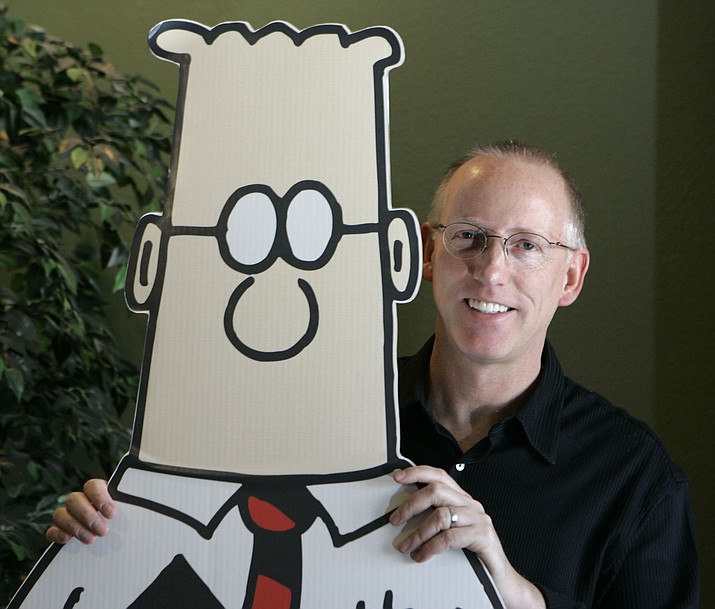 Scott Adams, creator of the comic strip Dilbert, poses for a portrait with the Dilbert character in his studio in Dublin, Calif., Oct. 26, 2006. Several prominent media publishers across the U.S. are dropping the Dilbert comic strip after Adams, its creator, described people who are Black as members of “a racist hate group” during an online video show. This week, his syndicate dropped him too. (Marcio Jose Sanchez/AP, File)
