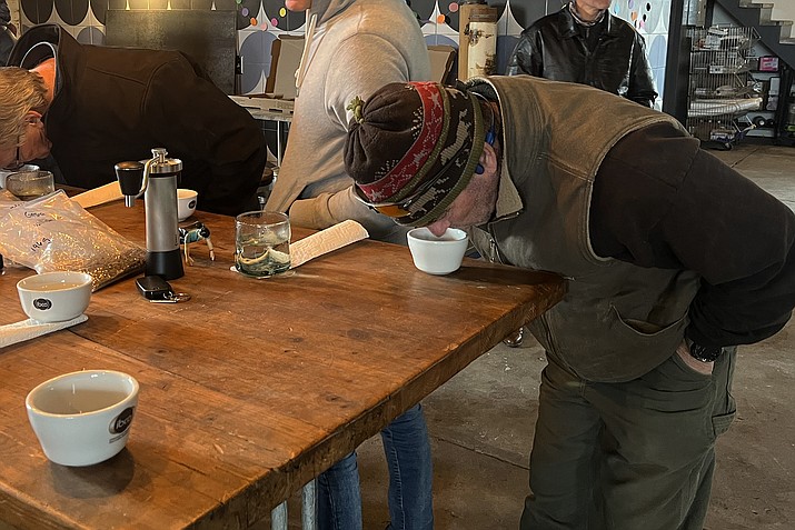 Community member Patrick Follett joins in on the cupping fun at the coffee tasting event Feb. 21. (Summer Serino/WGCN)