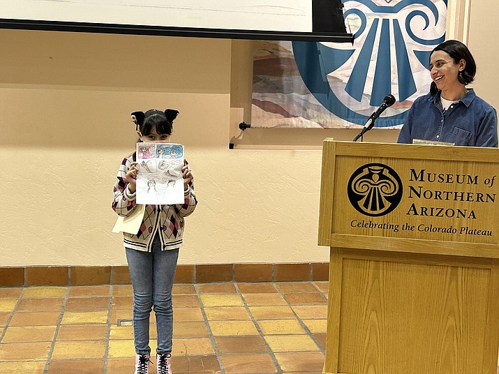 Michelle Billy holding her piece, The Beach (Photos/Museum of Northern Arizona)