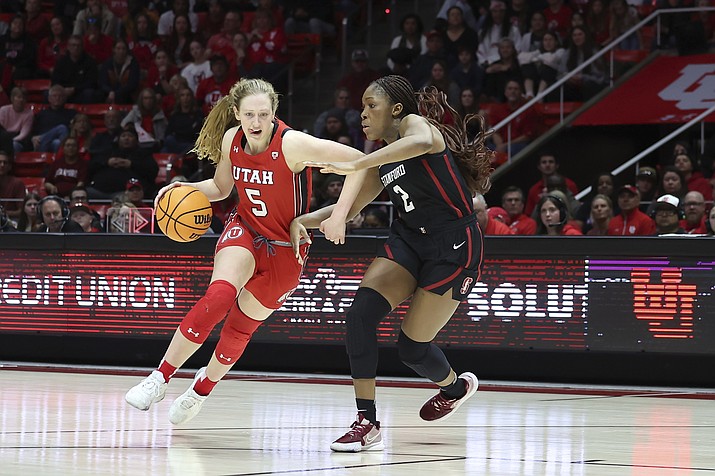 Utah guard Gianna Kneepkens (5) drives against Stanford guard Agnes Emma-Nnopu (2) in the second half of a NCAA game Saturday, Feb. 25, 2023, in Salt Lake City. (Rob Gray/AP)