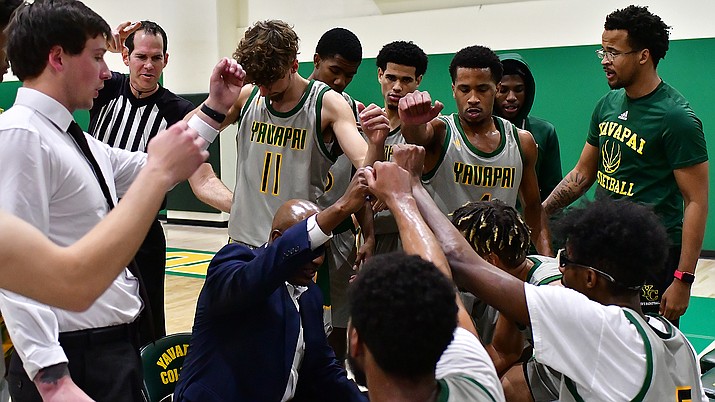 The Yavapai Community College men’s basketball team huddles around coach Jay Joyner. The players have had to rely on each other in a season that saw basketball back at the school for first time since 2011. (Chris Henstra/Yavapai Athletics)