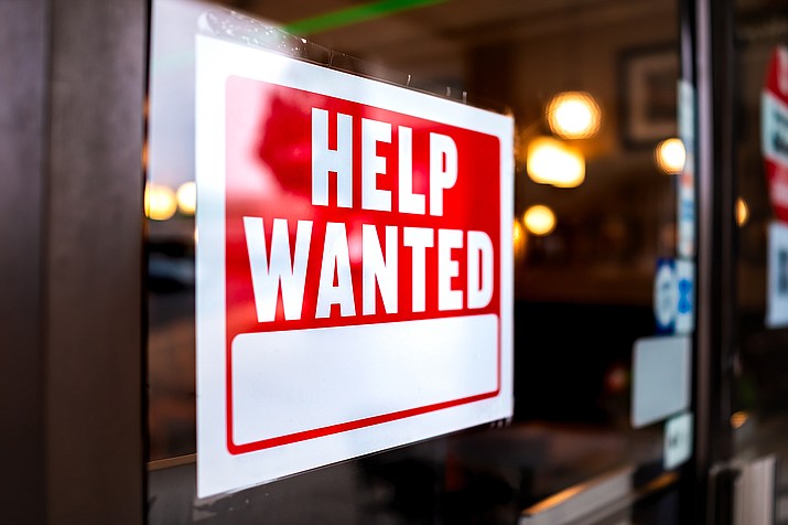 Economists say the churn of people moving between jobs is driving up wages. (Photo/Adobe Stock)