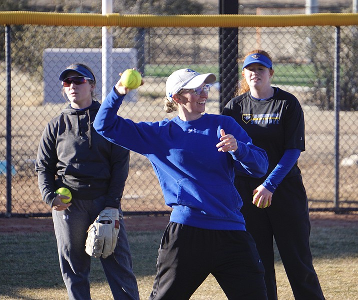 Embry-Riddle softball head coach Nicole Hennessey throws a ball during a practice on Thursday, Feb. 9, 2023, at the Embry-Riddle softball field in Prescott. (Aaron Valdez/Courier)