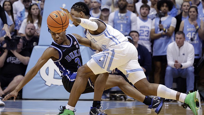 Duke guard Jeremy Roach (3) and North Carolina guard R.J. Davis, right, collide as they vie for the ball during the second half of an NCAA game Saturday, March 4, 2023, in Chapel Hill, N.C. (Chris Seward/AP)