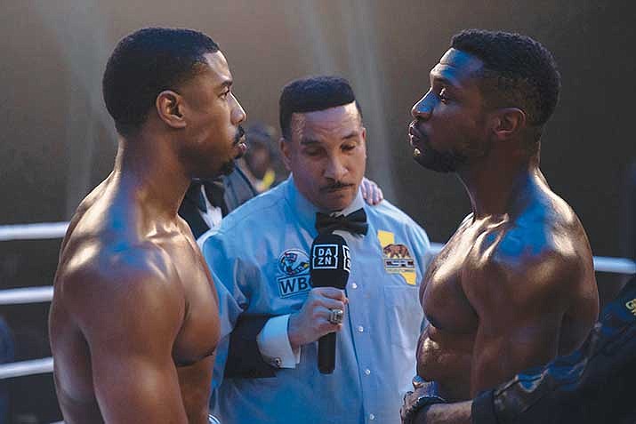 This image released by MGM shows Michael B. Jordan as Adonis Creed, left, and Jonathan Majors as Damian Anderson, right, in a scene from "Creed III." (Eli Ade/MGM via AP)