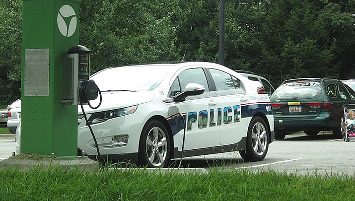 General Motors is offering buyouts to many members of its salaried work force as it seeks to trim costs as it transitions to electric vehicles. An electric Chevy Volt police cruiser is pictured. (Photo by Selena N. B. H., cc-by-sa-2.0, https://bit.ly/3mHkWjt)