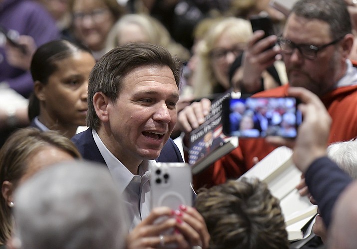 Florida Gov. Ron DeSantis greets people in the crowd during an event Friday, March 10, 2023, in Davenport, Iowa. (Ron Johnson/AP)