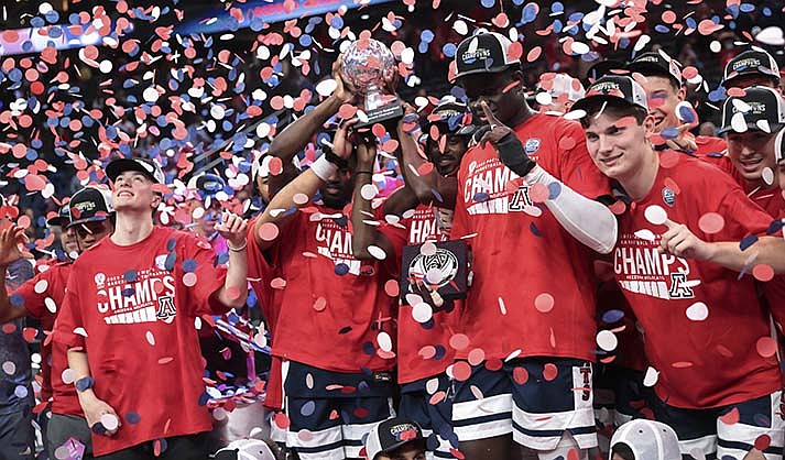 Arizona players celebrate after defeating UCLA in an NCAA college basketball game for the championship of the men's Pac-12 Tournament, Saturday, March 11, 2023, in Las Vegas. (AP Photo/Chase Stevens)