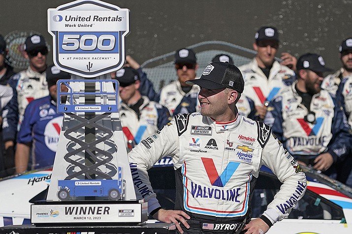 William Byron looks at his trophy after winning a NASCAR Cup Series auto race at Phoenix Raceway, Sunday, March 12, 2023, in Avondale, Ariz. (Darryl Webb/AP)