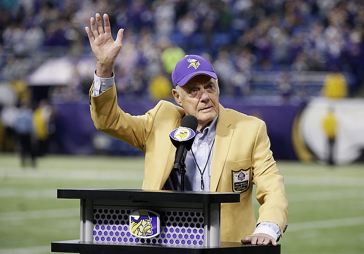 Former Minnesota Vikings Hall of Fame coach Bud Grant waves a final goodbye to the Metrodome during ceremonies following the Vikings NFL football against the Detroit Lions, Sunday, Dec. 29, 2013, in Minneapolis. Grant, the stoic and demanding Hall of Fame coach who took the Minnesota Vikings and their mighty Purple People Eaters defense to four Super Bowls in eight years and lost all of them, has died. He was 95. (Jim Mone, AP File