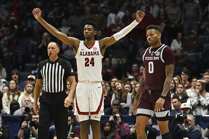 Alabama forward Brandon Miller (24) reacts as Texas A&M guard Dexter Dennis (0) looks on in the final minutes of an NCAA college basketball game in the finals of the Southeastern Conference Tournament, Sunday, March 12, 2023, in Nashville, Tenn. (John Amis/AP)
