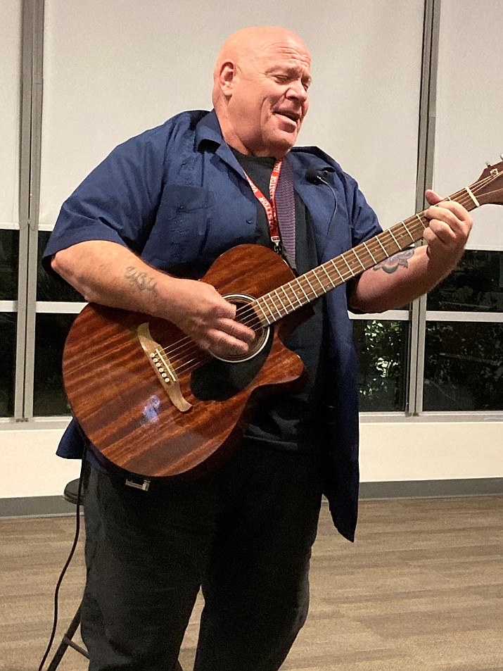 David Simmons plays a guitar. (Nanci Hutson/Courier)