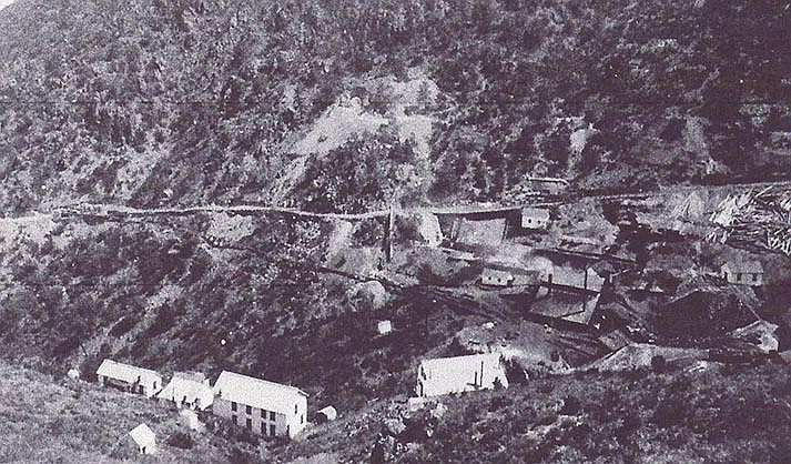 The United Verde Copper Company smelting works are located at the center right with the Town of Jerome, located down the County Wagon Road to the left. On the steep hillside above the road are the “Azure” (left), “Chrome” (center), and “Eureka” (right) mining claims and the hoist for the “Wade Hampton” claim (lower right edge). The offices and boarding houses are on the lower left. Erwin Baer, of Mitchell & Baer in Prescott, photographed the mines, smelter, and Jerome during the summer of 1884. (Jerome Historical Society)
