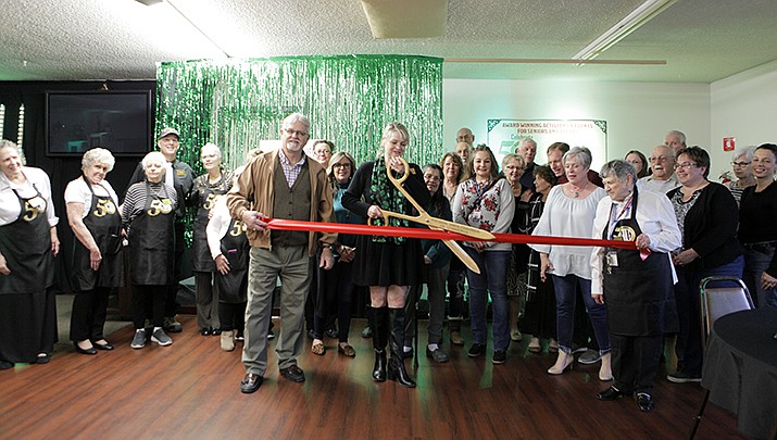 Officials cut the ribbon and celebrated renovations to the Kathryn Heidenreich Adult Center on Friday. (Photo by Claude Saravia/For the Miner)
