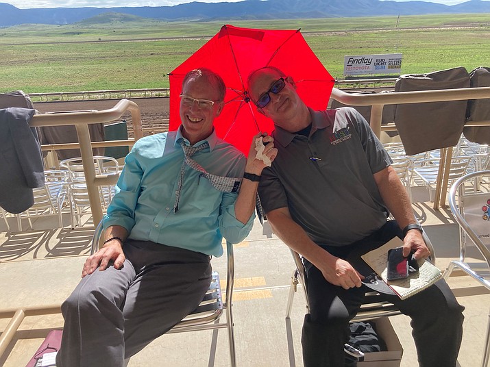 HUSD Superintendent John Pothast and Executive Director of Operations Kort Miner getting some shade at the Yavapai County rodeo grounds during the welcome ceremony for the 2021-22 school year.  Miner has announced he is leaving the district for a principal position in Glendale at the end of this school year. Pothast previously announced his retirement effective the end of the 2022-23 school year. (Nanci Hutson/Courier, file)