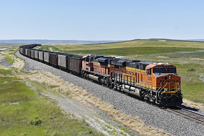 In this file photo, a BNSF railroad train hauling carloads of coal from the Powder River Basin of Montana and Wyoming is seen east of Hardin, Mont., on July 15, 2020. (Matthew Brown/AP, File)
