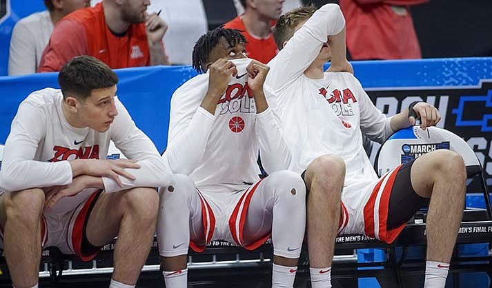 Arizona players sit on the bench in the final seconds of a first-round college basketball game against Princeton in the men's NCAA Tournament in Sacramento, Calif., Thursday, March 16, 2023. Princeton won 59-55. (AP Photo/Randall Benton)